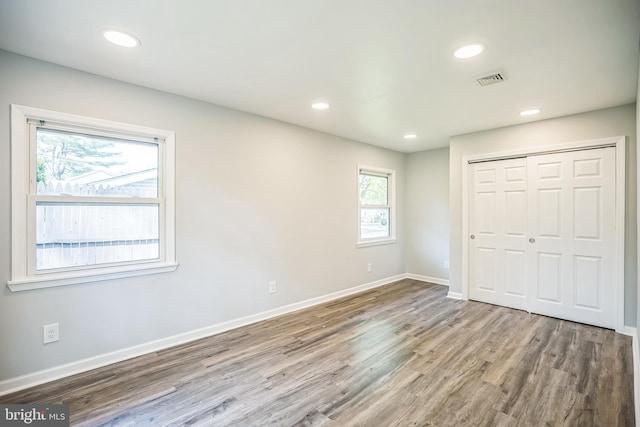32 Meadowlark Ln, Willingboro, NJ 08046 - unfurnished bedroom featuring visible vents, wood finished floors, baseboards, a closet, and recessed lighting
