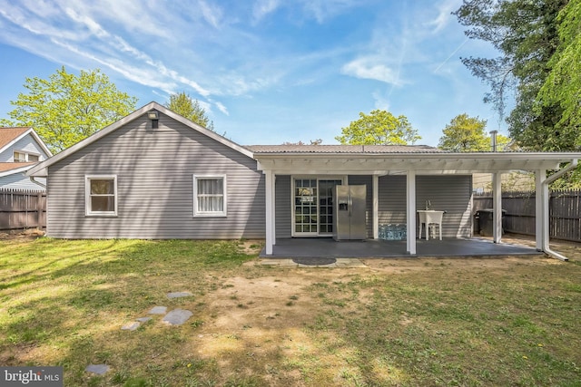 32 Meadowlark Ln, Willingboro, NJ 08046 - back of property featuring a patio, a lawn, and fence