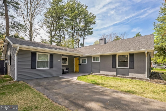 32 Meadowlark Ln, Willingboro, NJ 08046 - ranch-style home featuring brick siding, a front lawn, roof with shingles, and a chimney