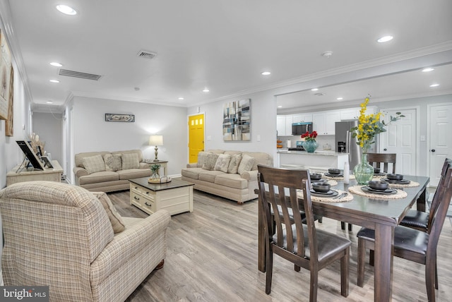 32 Meadowlark Ln, Willingboro, NJ 08046 - living room featuring recessed lighting, visible vents, ornamental molding, and light wood-style floors