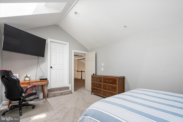 bedroom with carpet floors and vaulted ceiling with skylight