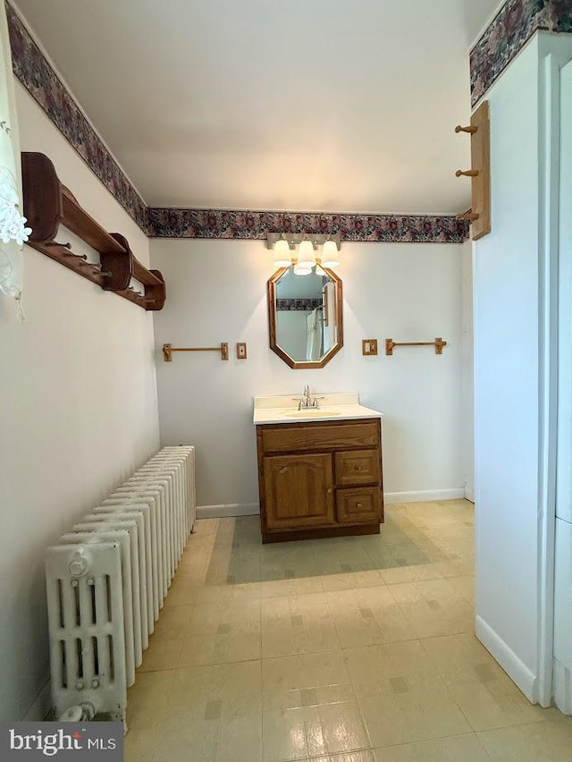 3660 Ginter Morann Hwy, Houtzdale, PA 16651 - bathroom with radiator heating unit, vanity, and baseboards