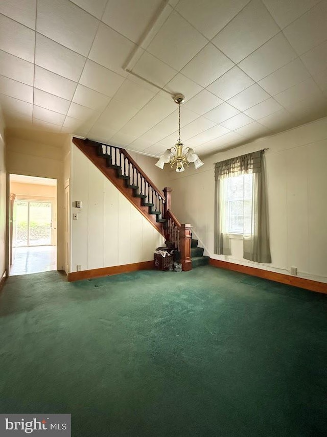 3660 Ginter Morann Hwy, Houtzdale, PA 16651 - unfurnished living room with stairs, a chandelier, and a healthy amount of sunlight
