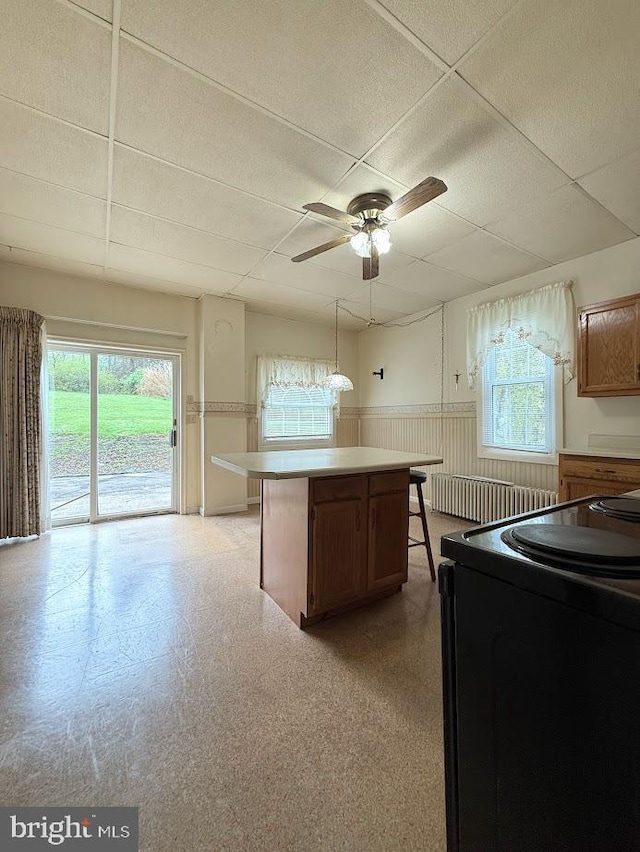 3660 Ginter Morann Hwy, Houtzdale, PA 16651 - kitchen featuring a wainscoted wall, a drop ceiling, electric range, and a wealth of natural light