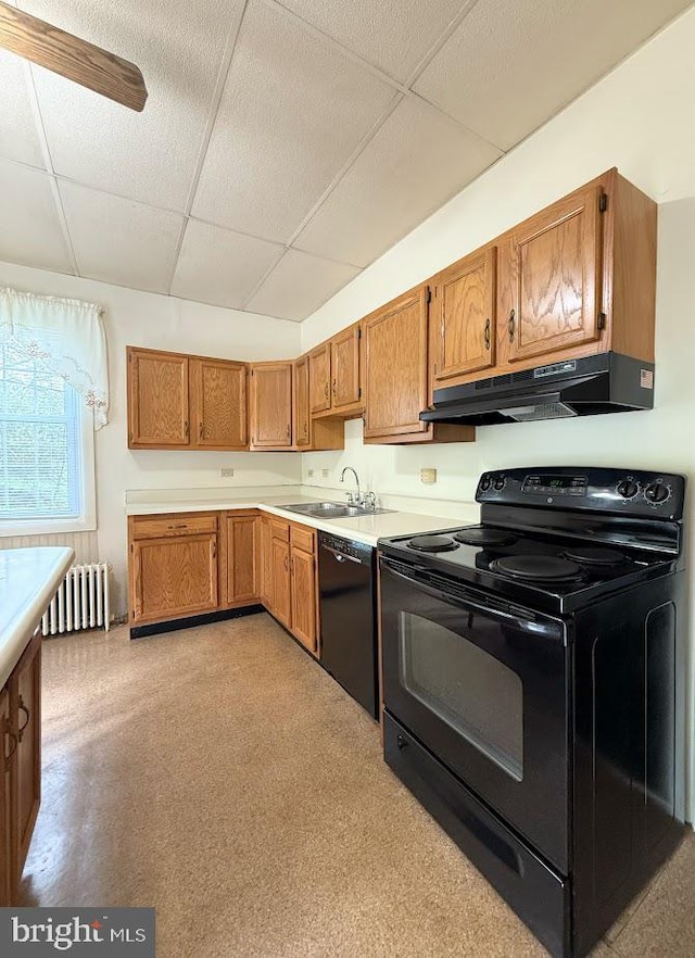 3660 Ginter Morann Hwy, Houtzdale, PA 16651 - kitchen featuring a drop ceiling, radiator heating unit, light countertops, under cabinet range hood, and black appliances