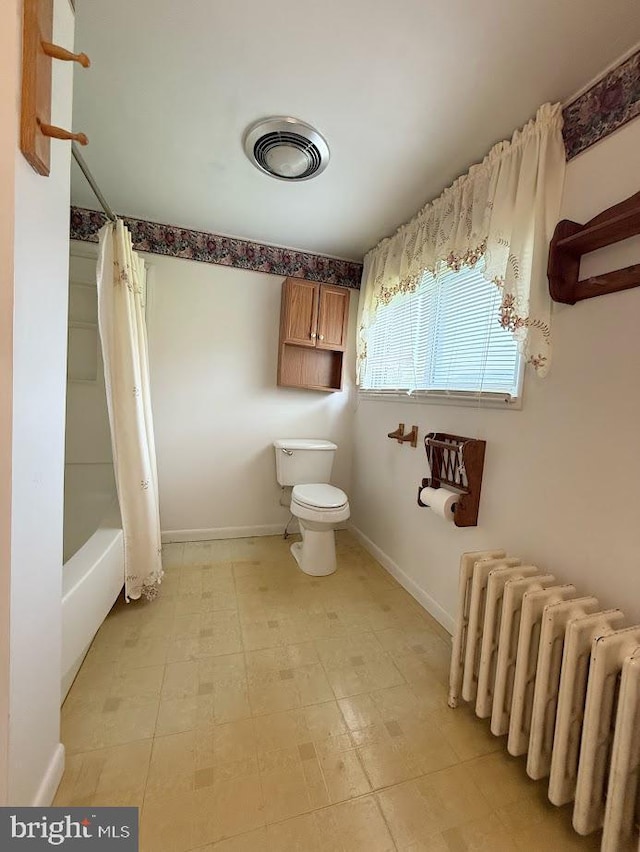 3660 Ginter Morann Hwy, Houtzdale, PA 16651 - bathroom with visible vents, toilet, baseboards, shower / bathtub combination with curtain, and radiator heating unit