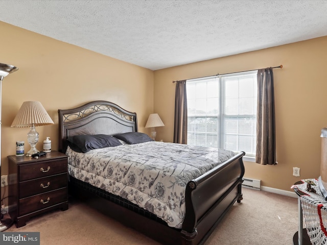 bedroom featuring light colored carpet, a textured ceiling, a baseboard heating unit, and baseboards