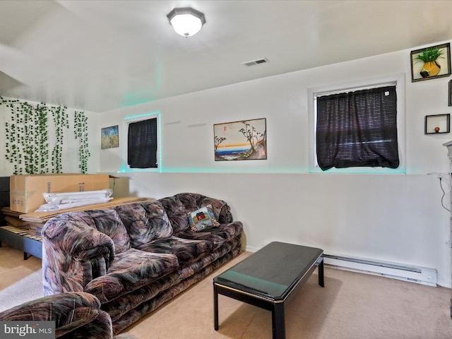carpeted living area with visible vents and baseboard heating