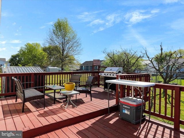 deck featuring a grill