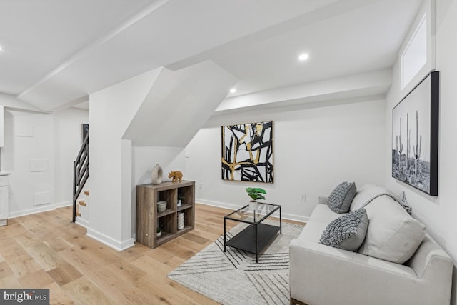 living room featuring recessed lighting, baseboards, stairway, and light wood-style floors