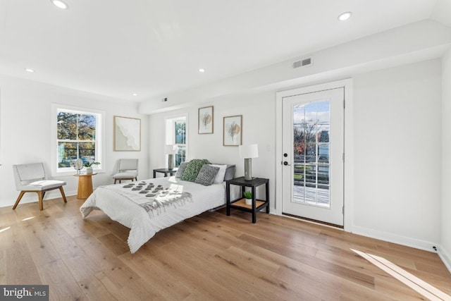 bedroom with visible vents, recessed lighting, light wood-style flooring, and access to outside