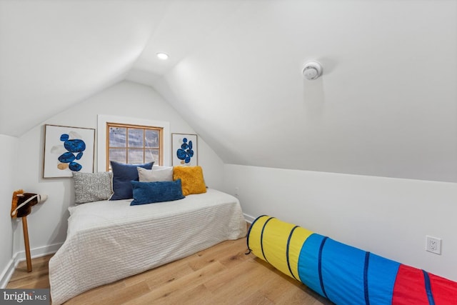 bedroom featuring lofted ceiling, wood finished floors, recessed lighting, and baseboards