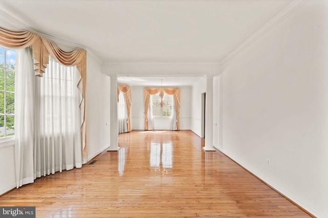 42935 Palliser Ct, Leesburg, VA 20176 - unfurnished room with crown molding, a notable chandelier, and light wood-style flooring