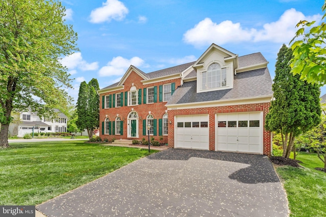 42935 Palliser Ct, Leesburg, VA 20176 - colonial inspired home with a front lawn, driveway, a shingled roof, and brick siding