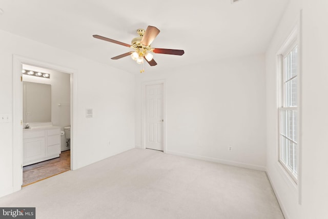 42935 Palliser Ct, Leesburg, VA 20176 - unfurnished bedroom featuring ceiling fan, connected bathroom, and light colored carpet