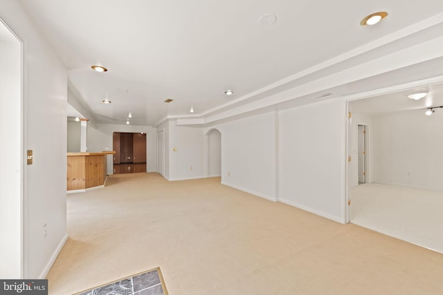42935 Palliser Ct, Leesburg, VA 20176 - unfurnished living room with arched walkways, light carpet, and baseboards