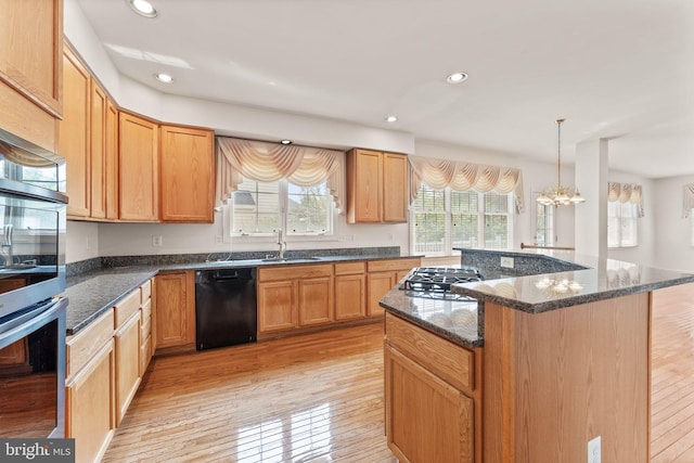 42935 Palliser Ct, Leesburg, VA 20176 - kitchen featuring light wood-type flooring, a center island, appliances with stainless steel finishes, and recessed lighting