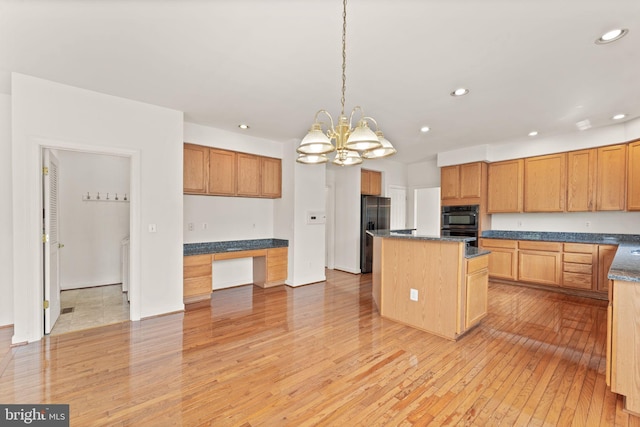 42935 Palliser Ct, Leesburg, VA 20176 - kitchen featuring recessed lighting, light wood-style floors, stainless steel fridge, a center island, and built in study area