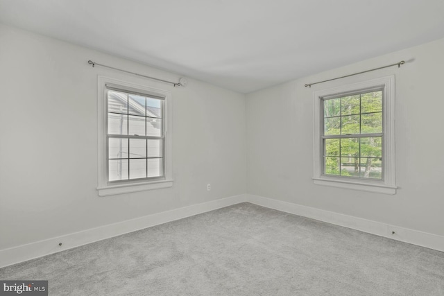 2418 Forest Glen Rd, Silver Spring, MD 20910 - carpeted spare room featuring baseboards and a healthy amount of sunlight