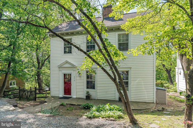 2418 Forest Glen Rd, Silver Spring, MD 20910 - colonial inspired home featuring fence, a chimney, and a shingled roof
