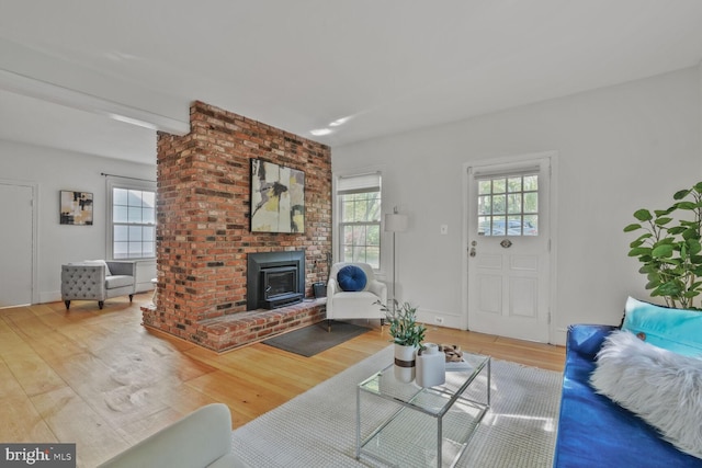 2418 Forest Glen Rd, Silver Spring, MD 20910 - living area featuring a wood stove and wood finished floors
