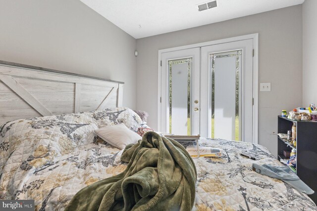 bedroom featuring visible vents, access to exterior, and french doors