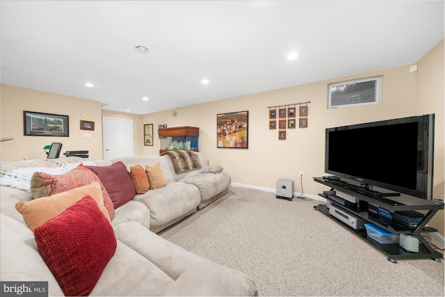 carpeted living room featuring baseboards and recessed lighting