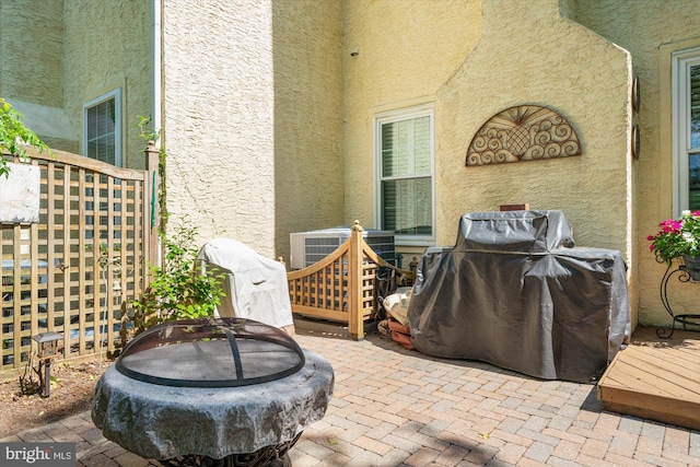 view of patio / terrace featuring a deck and a grill