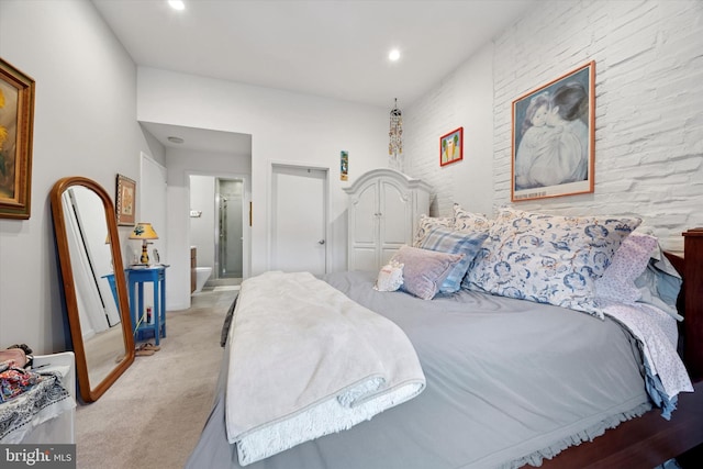 carpeted bedroom featuring recessed lighting and ensuite bathroom
