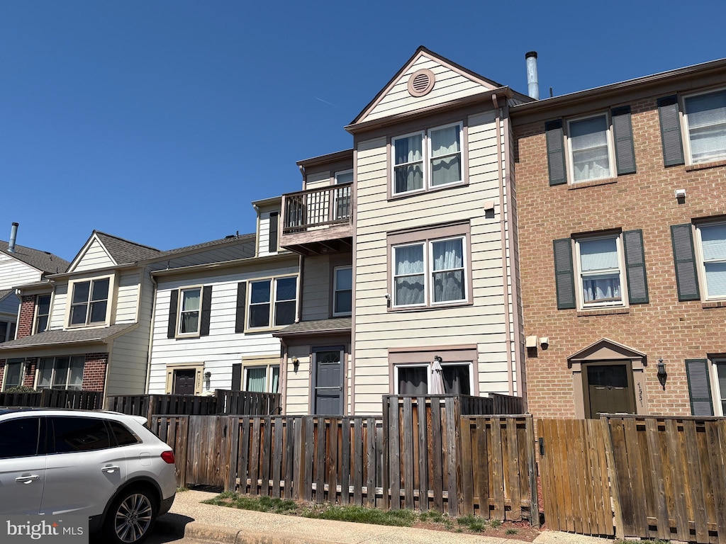 multi unit property featuring a fenced front yard