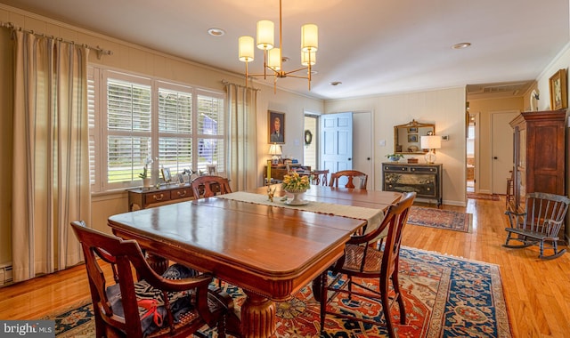 2231 Whays Creek Rd, Reedville, VA 22539 - dining space with an inviting chandelier, light wood finished floors, and ornamental molding