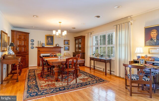 2231 Whays Creek Rd, Reedville, VA 22539 - dining area with ornamental molding, visible vents, an inviting chandelier, and light wood-style floors