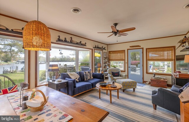 2231 Whays Creek Rd, Reedville, VA 22539 - living area featuring visible vents, ceiling fan, ornamental molding, and a water view