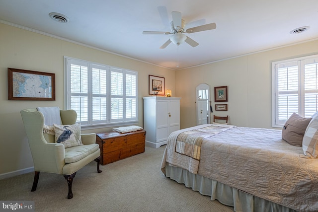 2231 Whays Creek Rd, Reedville, VA 22539 - bedroom with crown molding, light colored carpet, visible vents, and multiple windows