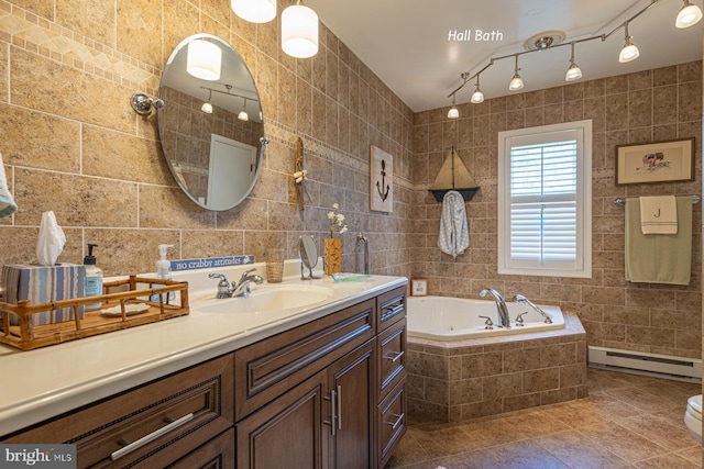 2231 Whays Creek Rd, Reedville, VA 22539 - full bath with a baseboard heating unit, tile patterned flooring, tile walls, vanity, and a jetted tub