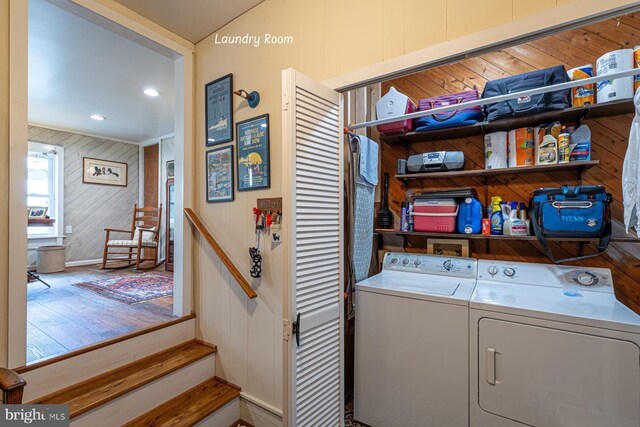 2231 Whays Creek Rd, Reedville, VA 22539 - laundry room featuring independent washer and dryer, baseboards, wooden walls, wood finished floors, and laundry area