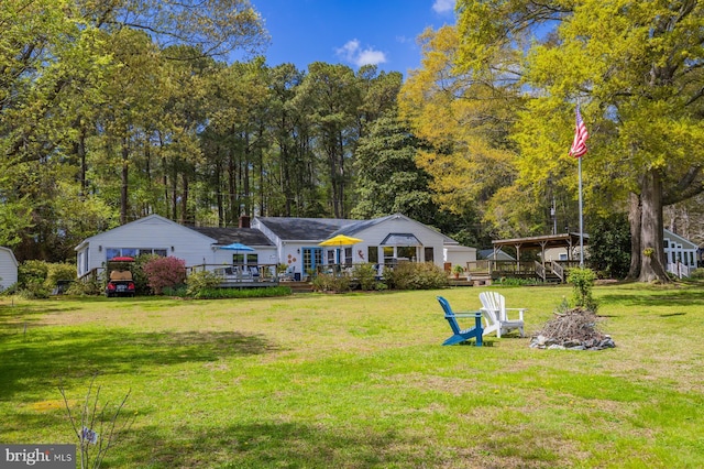 2231 Whays Creek Rd, Reedville, VA 22539 - rear view of house with a deck and a yard