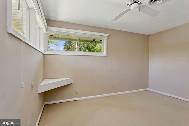 unfurnished room featuring baseboards, a ceiling fan, and carpet flooring