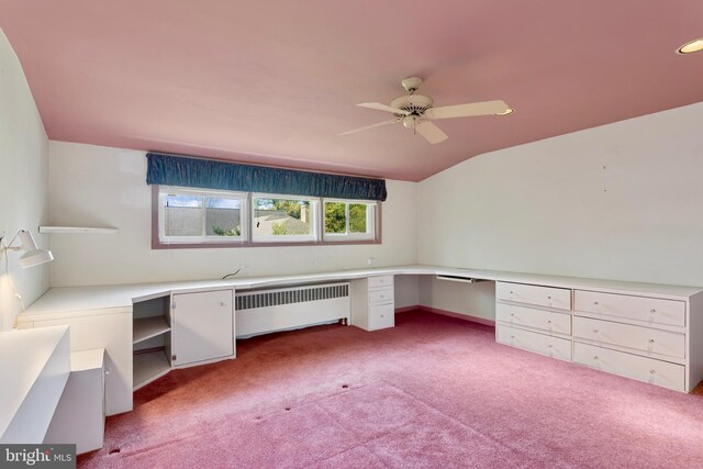 unfurnished office with a ceiling fan, built in study area, lofted ceiling, radiator, and carpet flooring