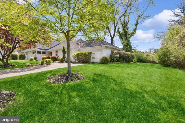 exterior space with a yard and driveway