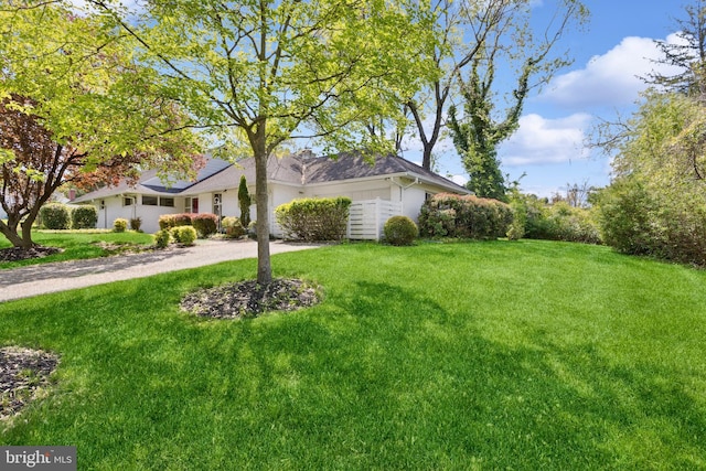 exterior space with a yard and driveway
