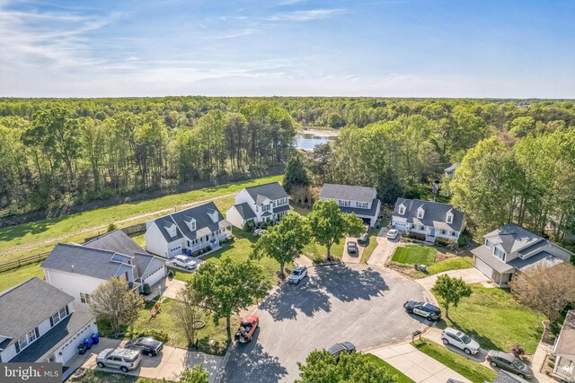 aerial view featuring a residential view and a forest view
