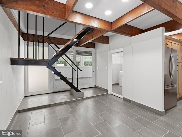 interior space with beamed ceiling, recessed lighting, baseboards, and stairway