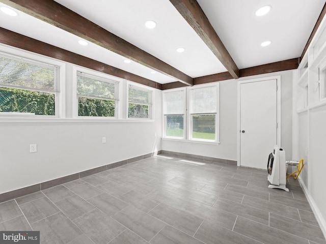 interior space with baseboards, recessed lighting, and beam ceiling