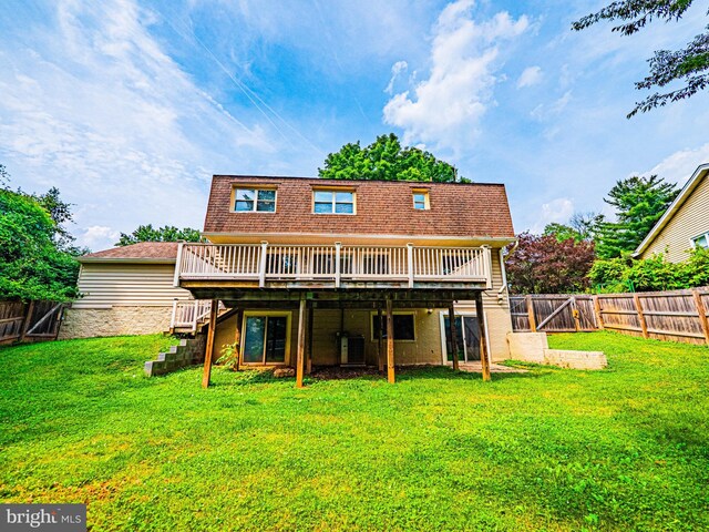 12136 Pawnee Dr, Gaithersburg, MD 20878 - back of house with a wooden deck, stairway, and a fenced backyard