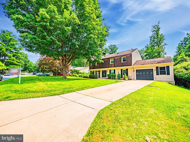 12136 Pawnee Dr, Gaithersburg, MD 20878 - dutch colonial with an attached garage, a front lawn, driveway, and a shingled roof