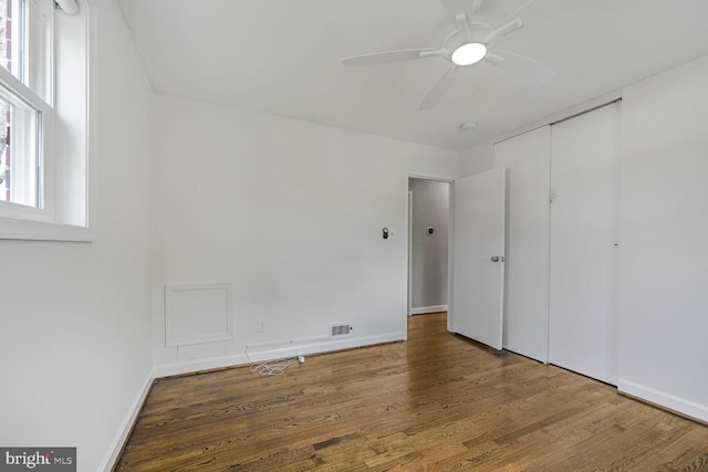 12011 Ashley Dr, Rockville, MD 20852 - unfurnished bedroom featuring baseboards, wood finished floors, and visible vents