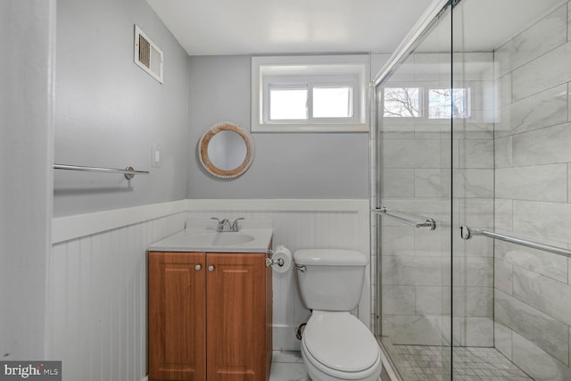 12011 Ashley Dr, Rockville, MD 20852 - bathroom featuring a wainscoted wall, a stall shower, toilet, and visible vents