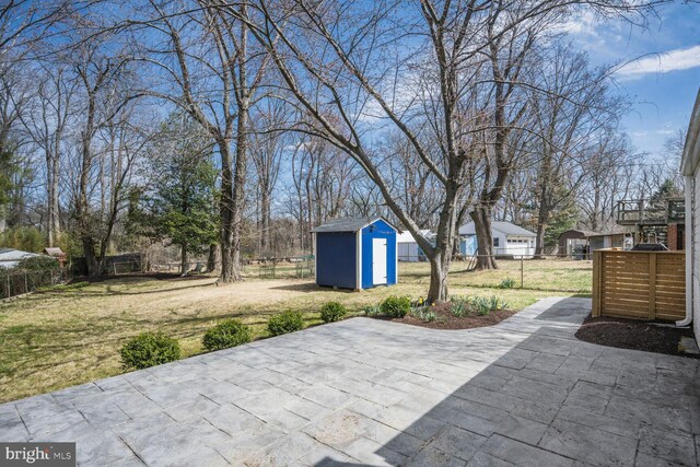 12011 Ashley Dr, Rockville, MD 20852 - view of patio / terrace featuring an outdoor structure, a storage shed, and fence private yard