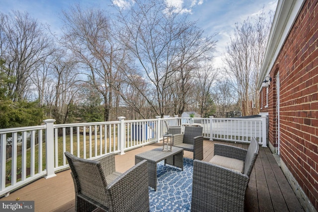 12011 Ashley Dr, Rockville, MD 20852 - wooden deck featuring an outdoor living space
